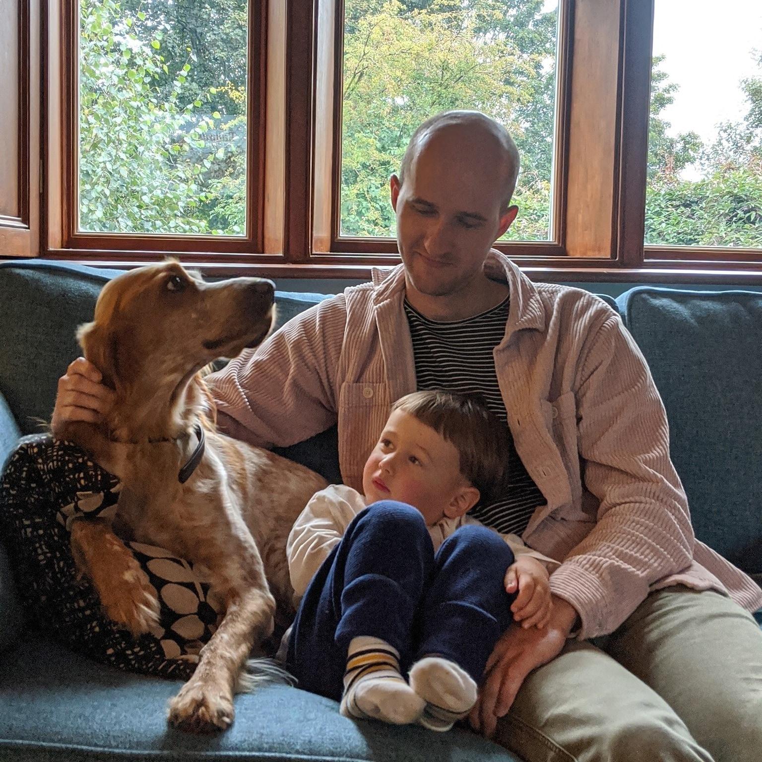 Oliver Ash with a dog and one of the sons